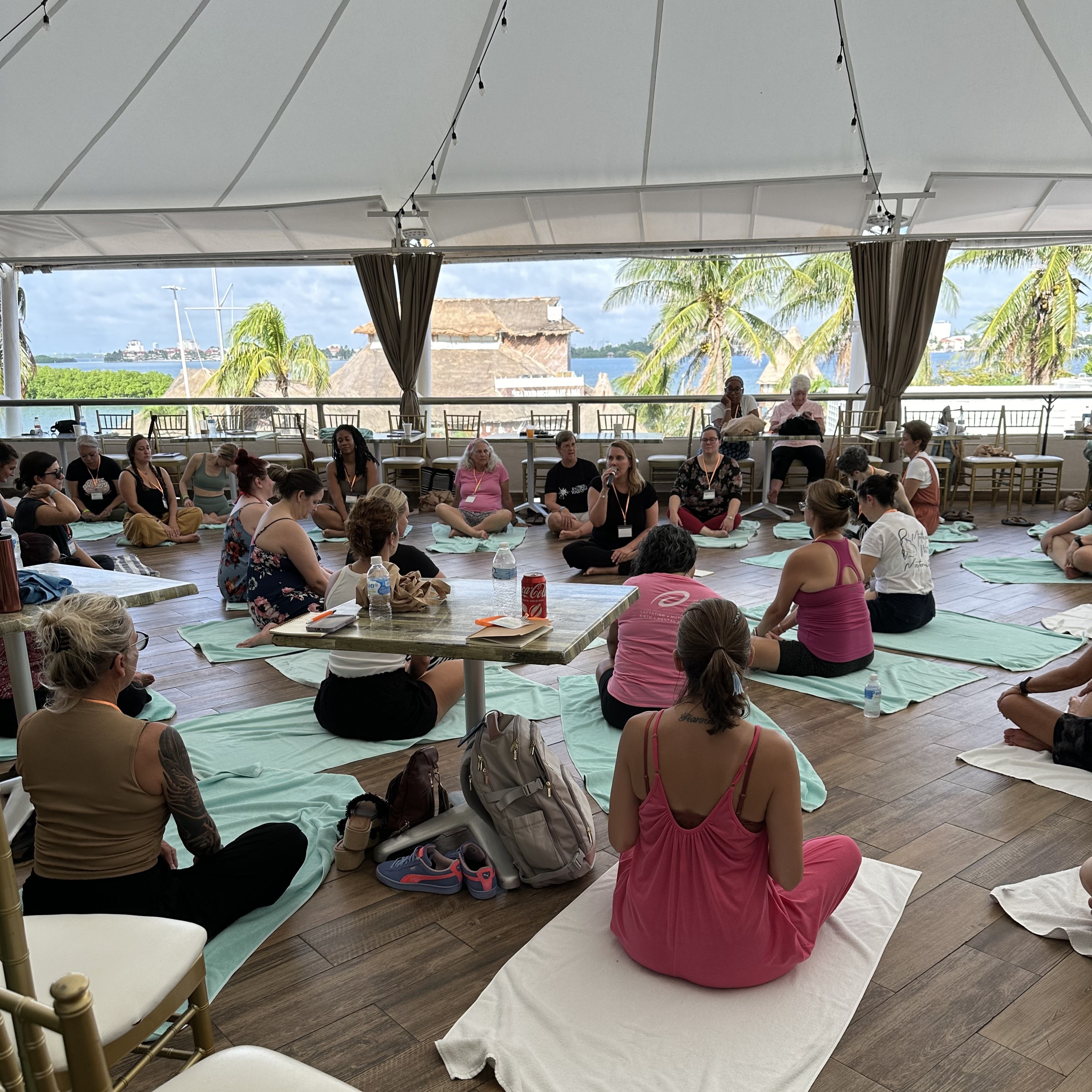 Wellness session with attendees on yoga mats