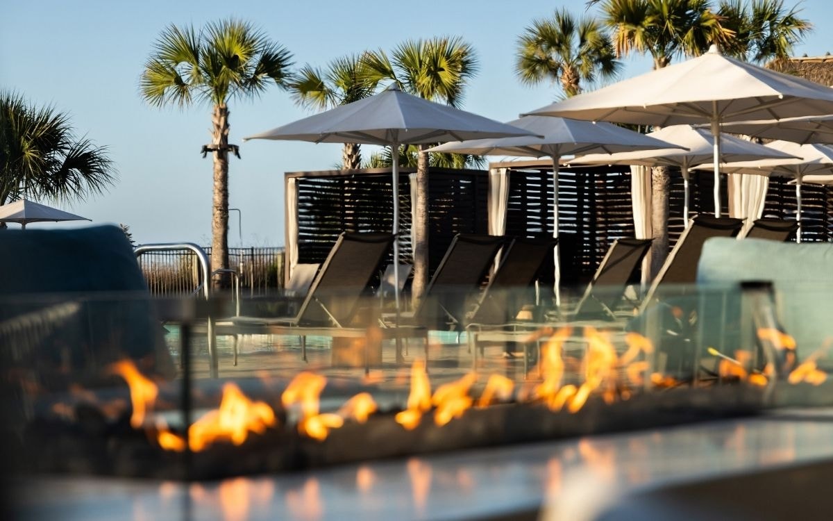 Lactivents Spring 2027 venue pool with fire feature and palm trees